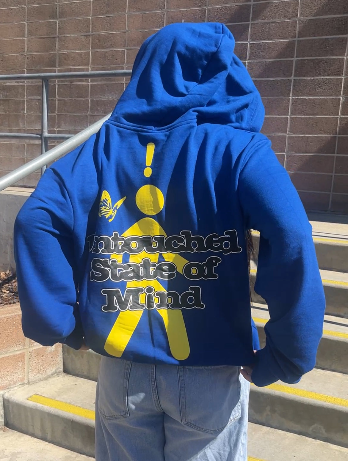 blue and yellow zip-up