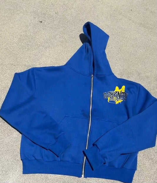 blue and yellow zip-up